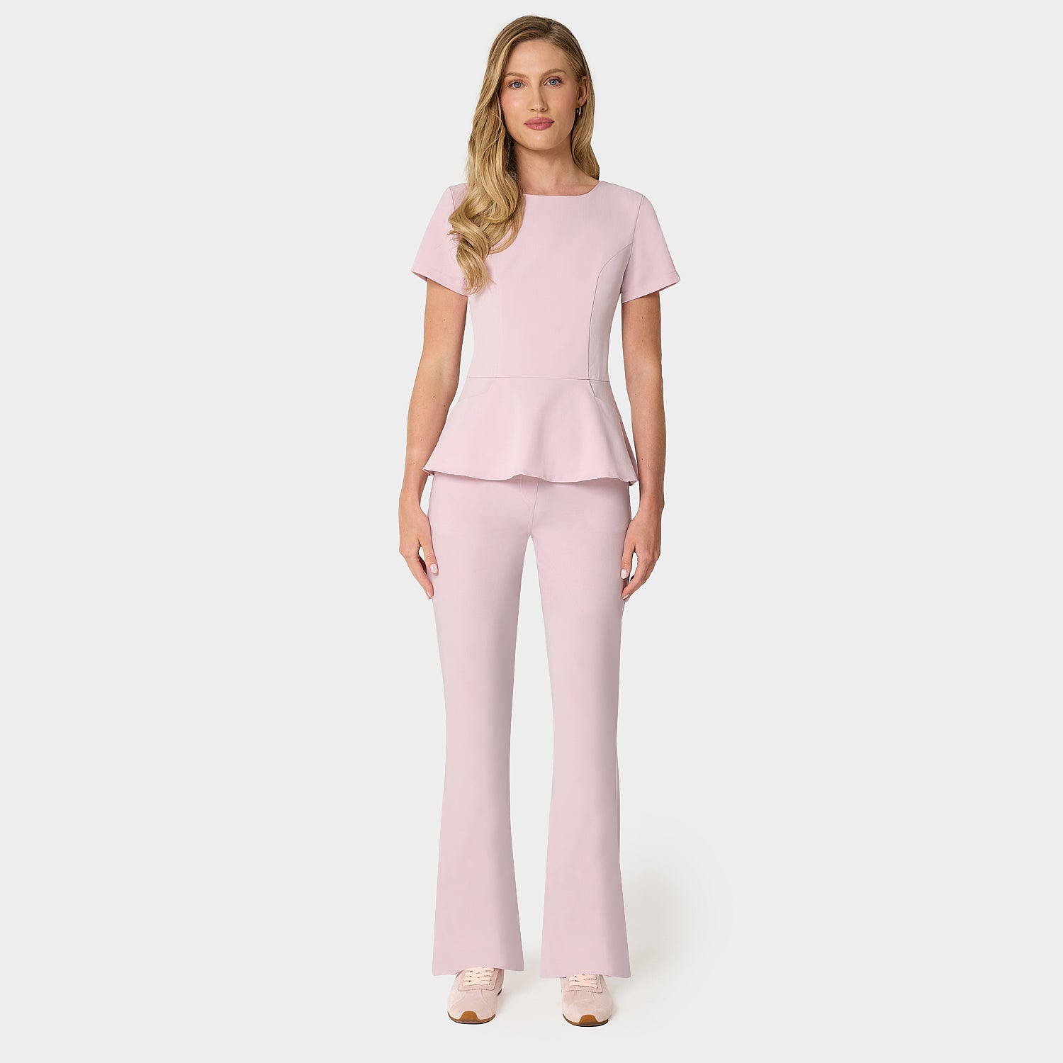 Bluza medyczna damska KIM w odcieniu Pastel Pink z krytym zamkiem na plecach i baskinką - Vena Uniformy